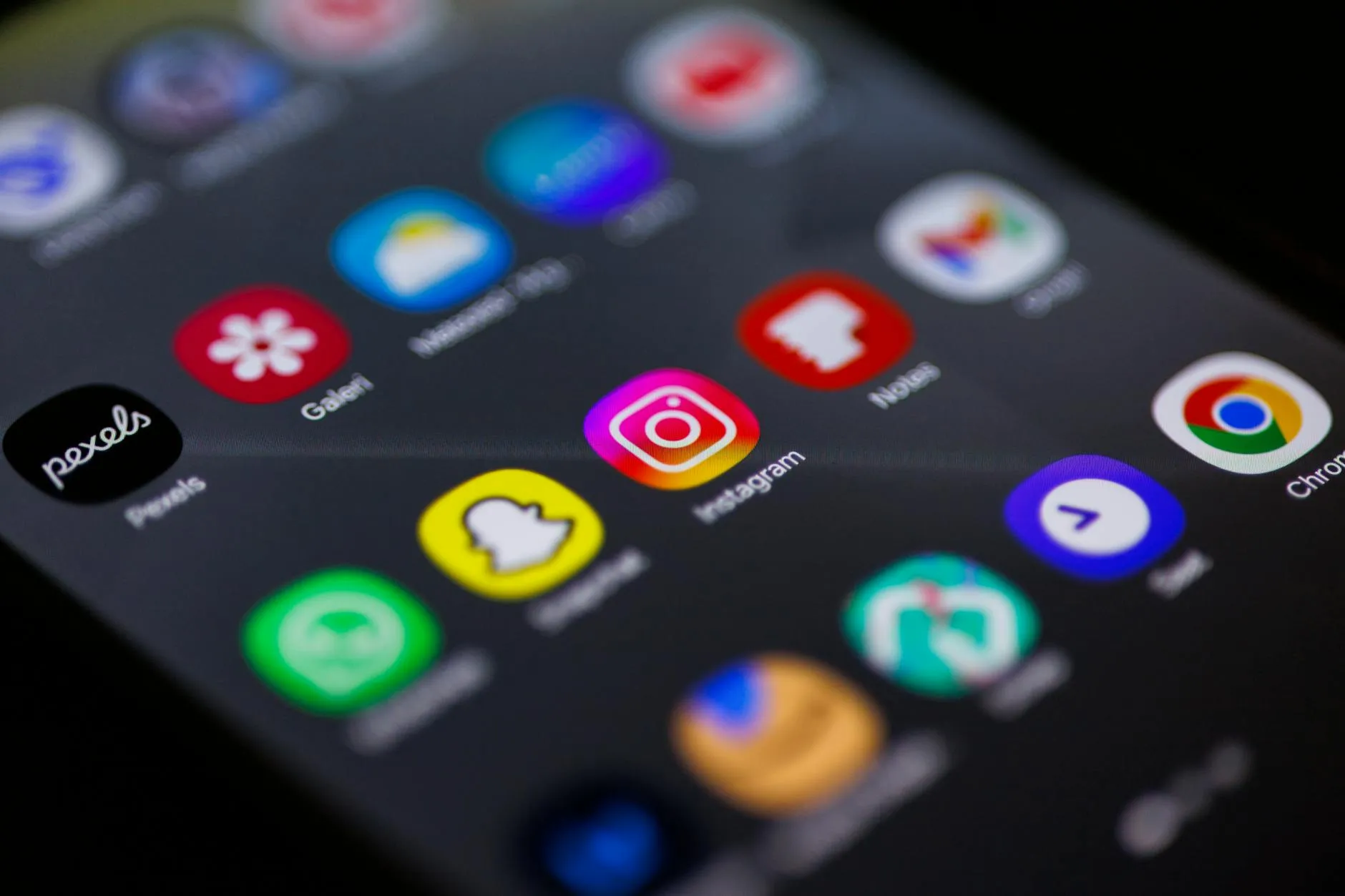 Social media marketer researching Instagram hashtag strategy on desktop screen